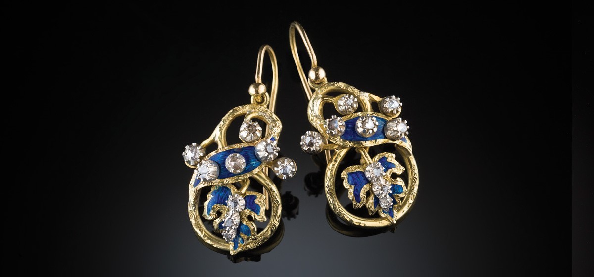 Antique pendant gold earrings with enamelled ribbon and leaf motifs embellished with rose cut diamonds set in silver