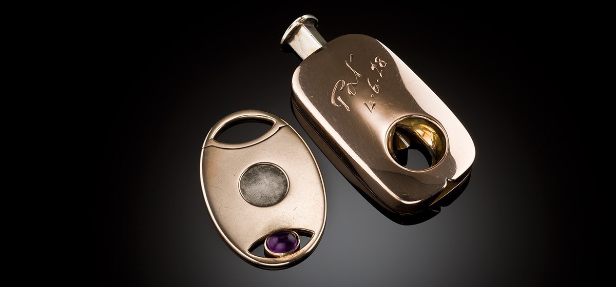 An art deco rose gold cigar cutter