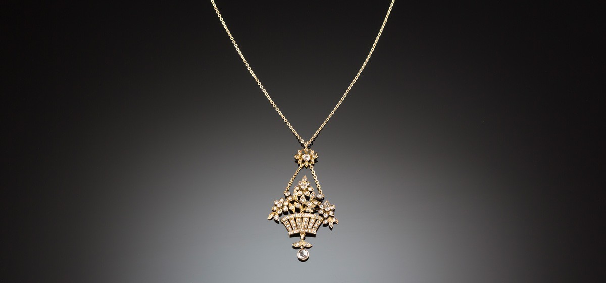 An Antique yellow gold and diamond set flower basket pendant/brooch