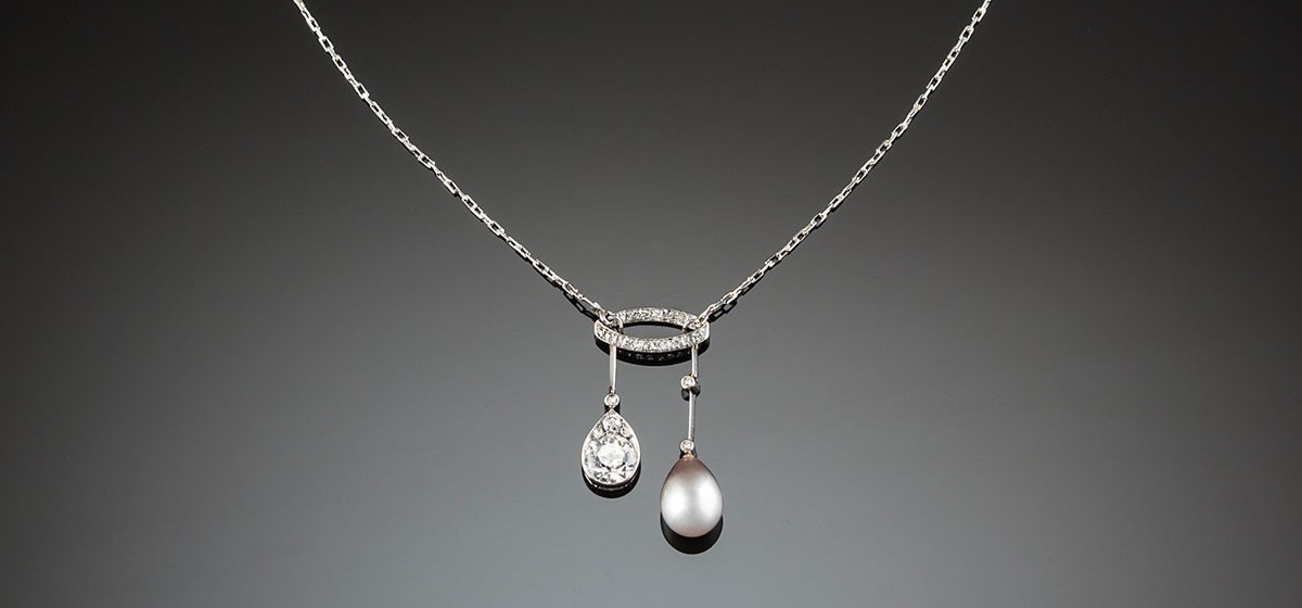 A Belle Epoque diamond, natural pearl and platinum lavaliere necklace 