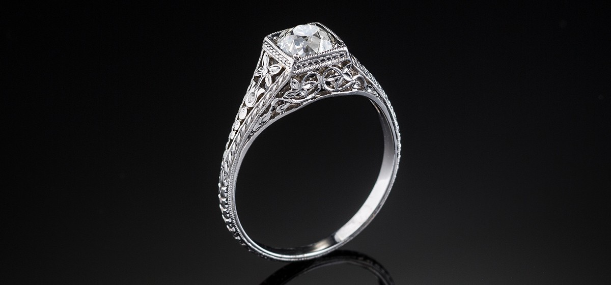 An Early Twentieth Century solitaire old cut diamond ring in an orange blossom platinum mount