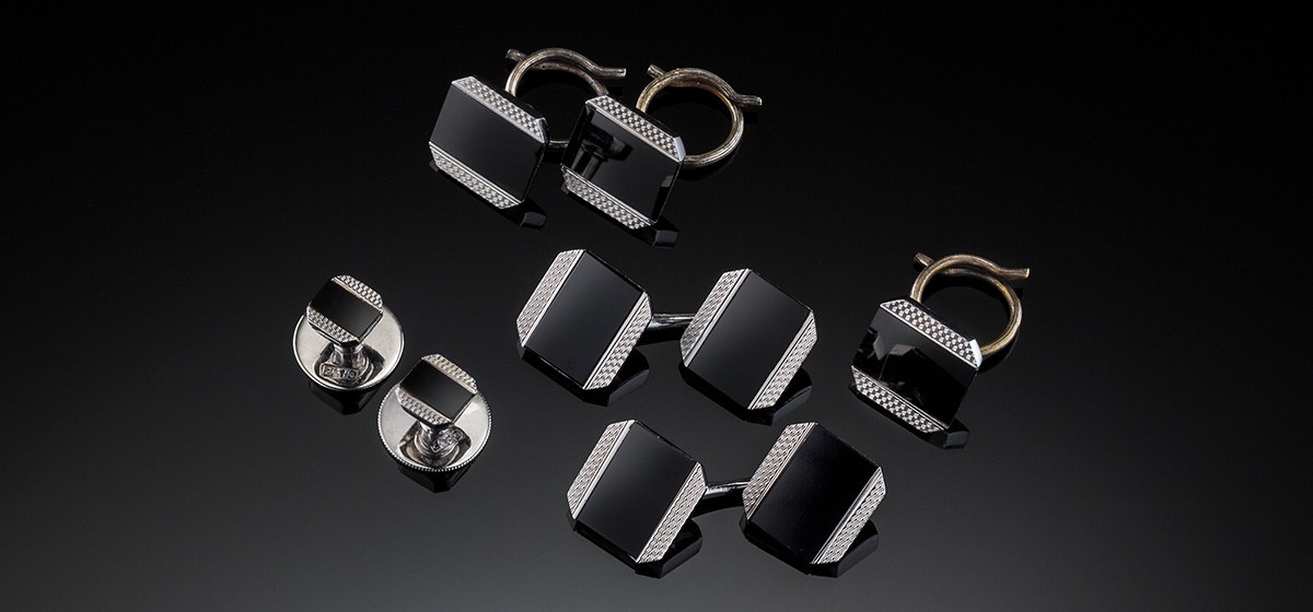 An Art Deco white gold and black enamel dinner set by Cropp and Farr