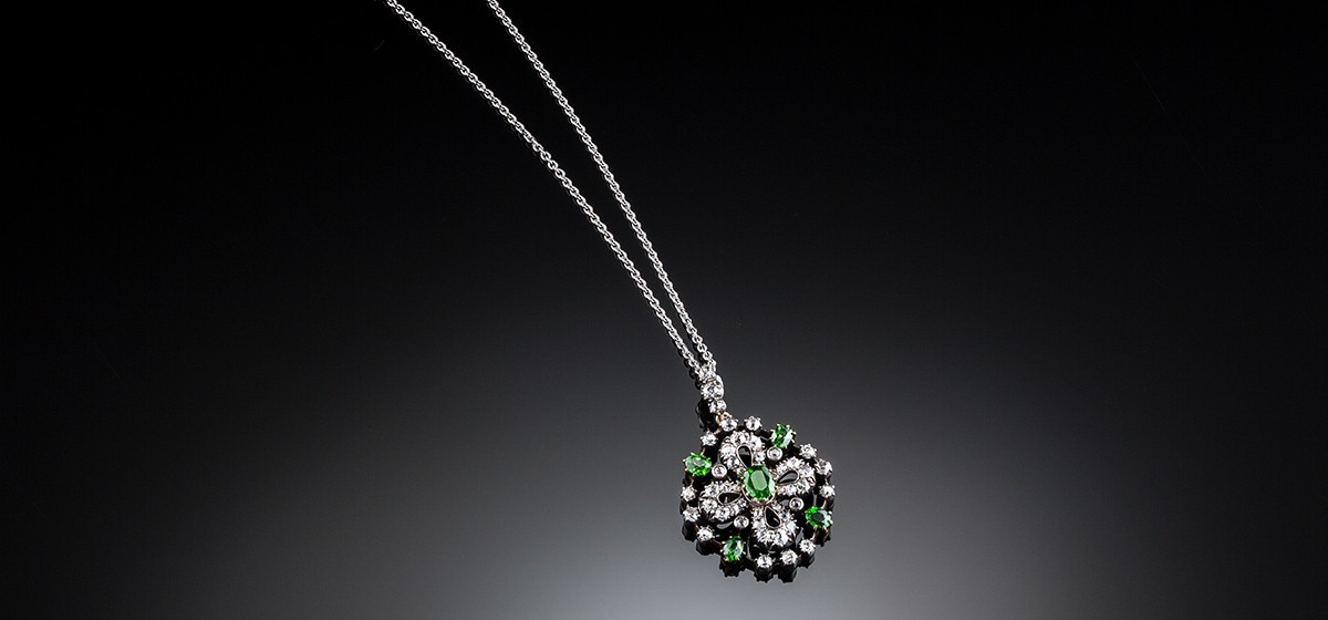 Antique diamond and demantoid garnet set pendant