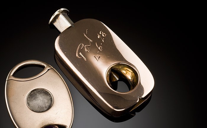 An art deco rose gold cigar cutter