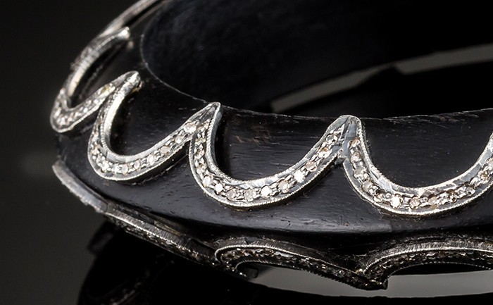 An Art Deco ebony and diamond set bangle