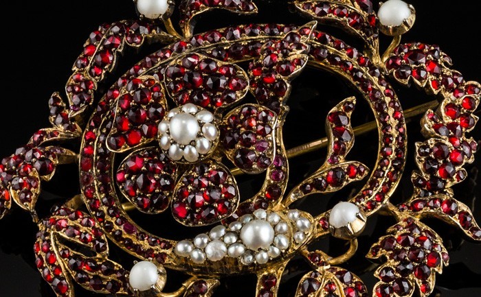 Detail of a large Antique garnet and pearl brooch