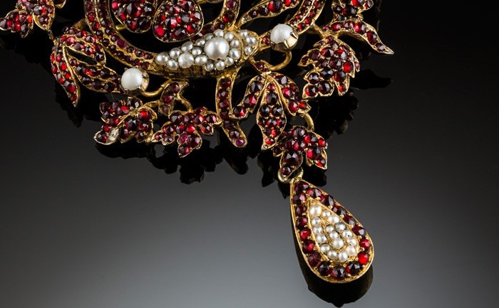 Detail of a large Antique garnet and pearl brooch