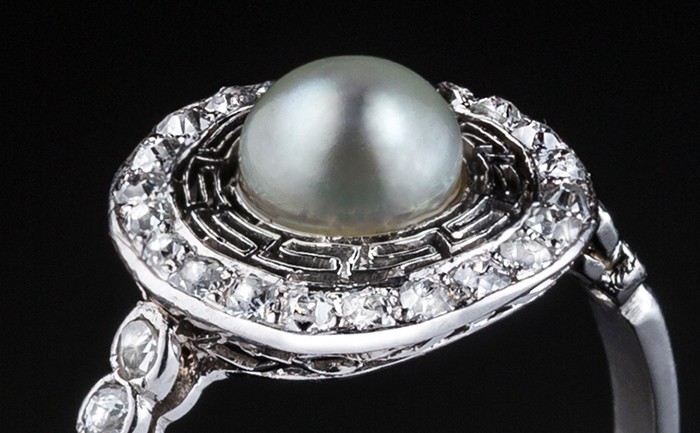 Detail of a Belle Epoque pearl and old cut diamond platinum set fine ring