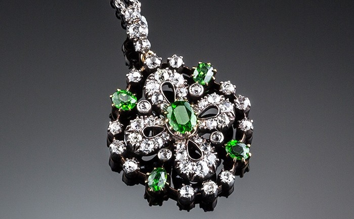 Detail of Antique diamond and demantoid garnet set pendant