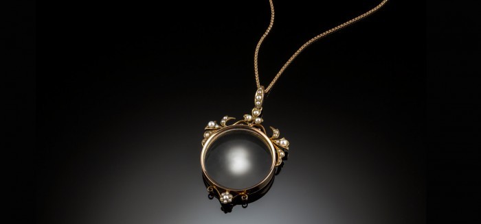 A fine Antique Australian photograph locket in yellow gold and seed pearls by goldsmiths, Hall & Co